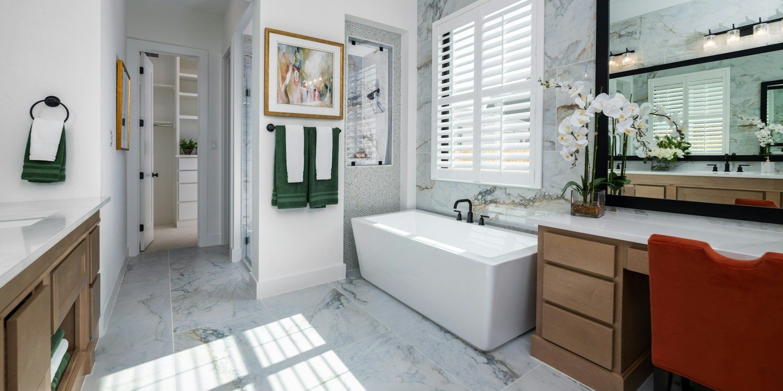 a bathroom with a tub, sink, and mirror
