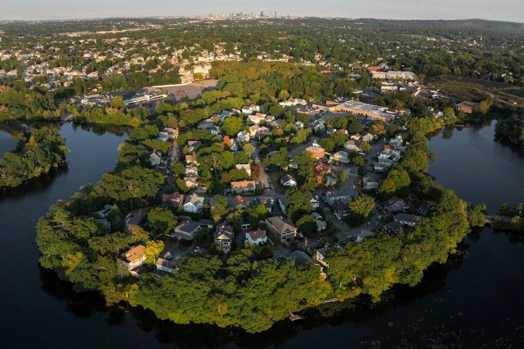 Aerial view of a peninsula neighborhood surrounded by water.