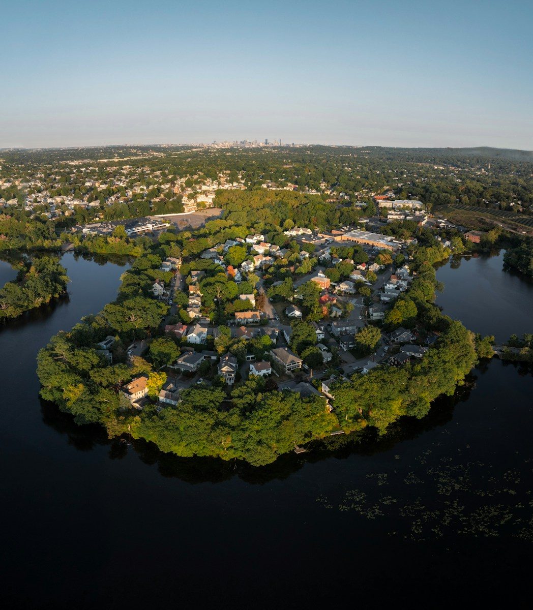 Aerial view of a peninsula neighborhood surrounded by water.